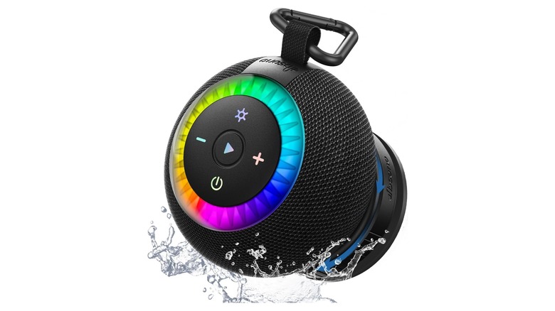 Stock photo of a round black speaker with multicolored LED lights