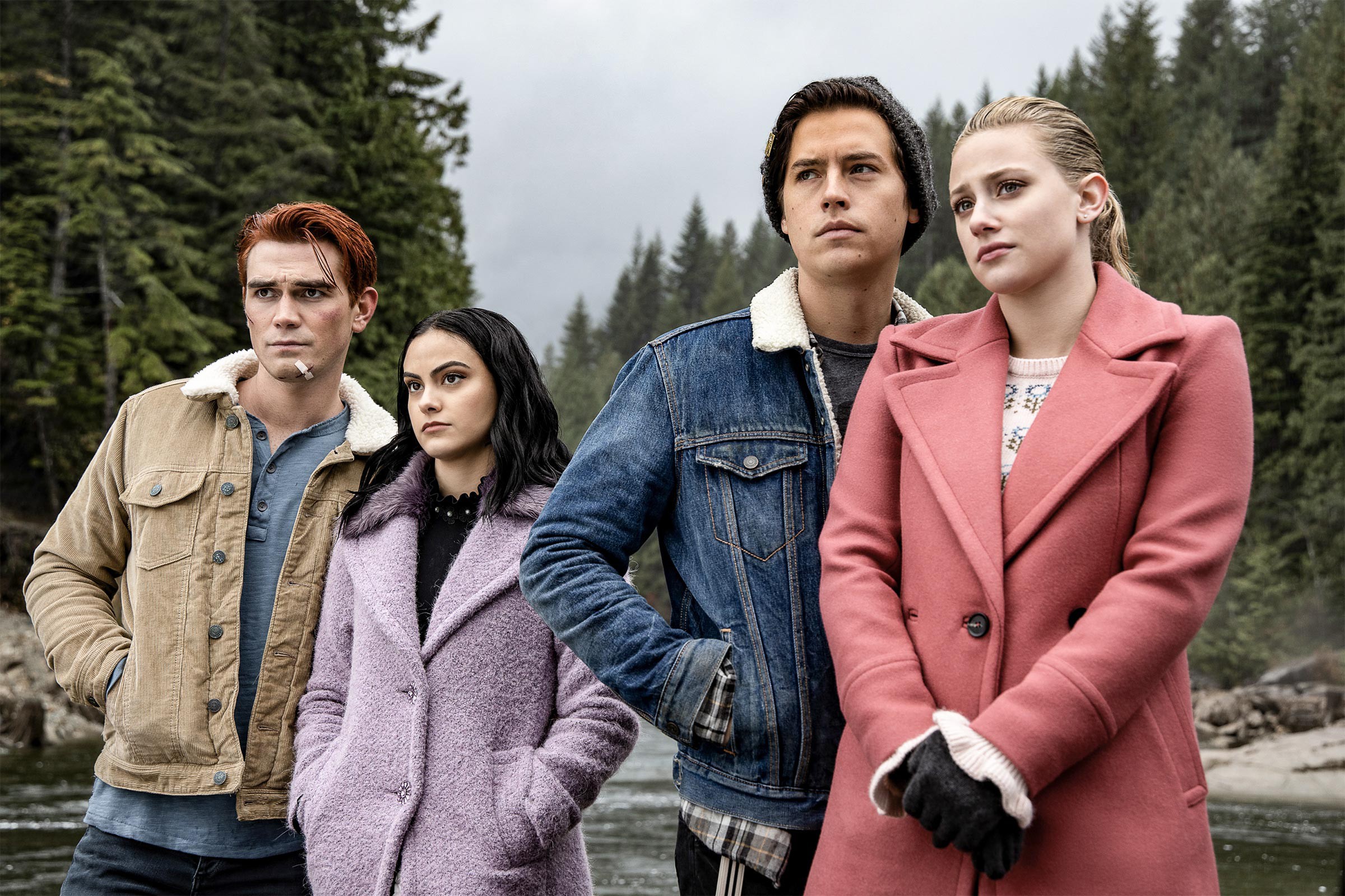 From left, KJ Apa, Camila Mendes, Cole Sprouse, and Lili Reinhart looking out over a river in a scene from 