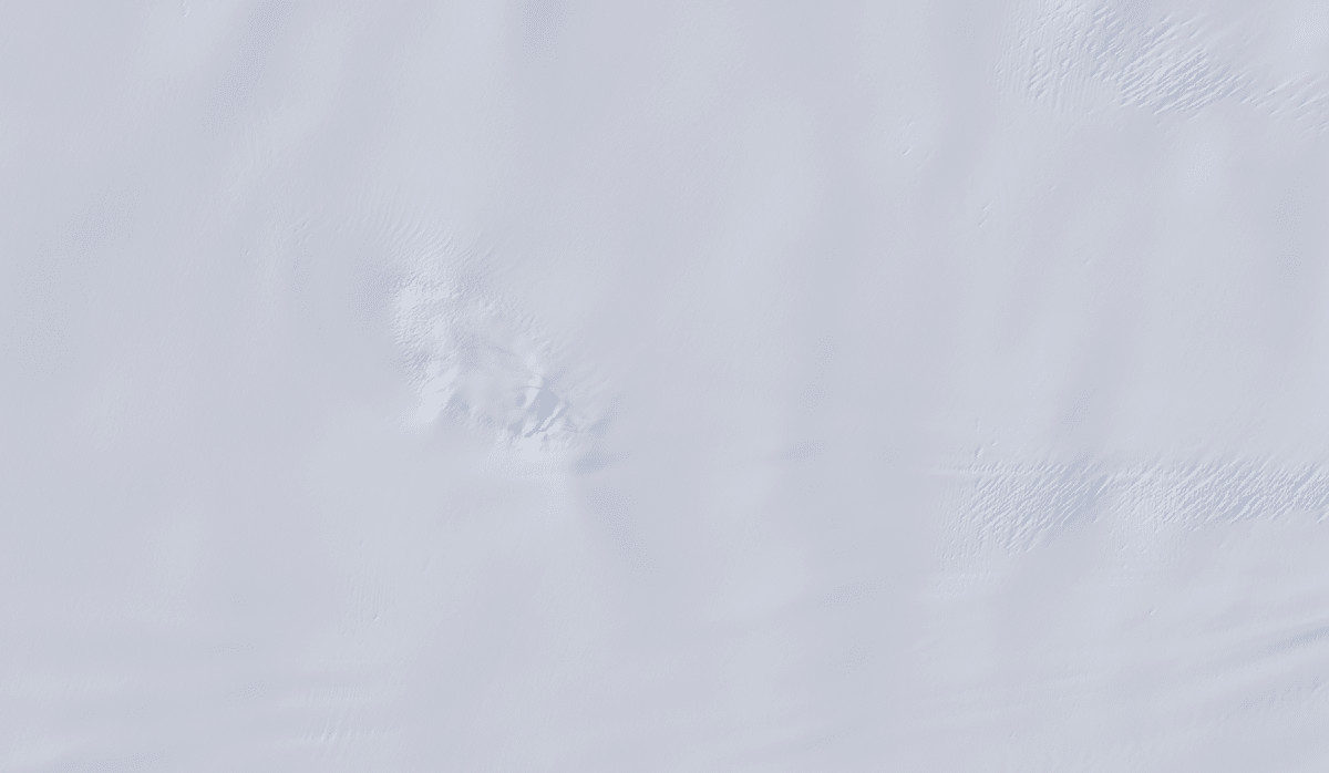 An image from the Landsat 9 satellite shows Nunatak Zaterjavshijsja on Nov. 2, 2025. Because microwaves can penetrate frozen surfaces, signals from NISAR’s L-band radar captured more detail of the structure of the surrounding icescape than is visible in this optical image. Credit: USGS