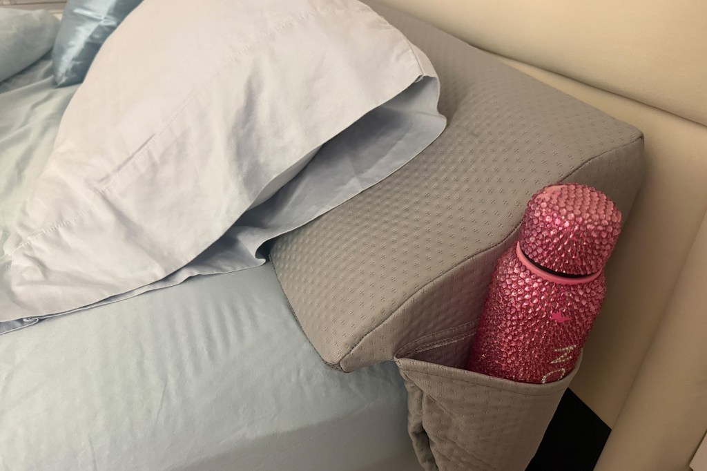 This plush pillow stops my essentials from disappearing in the cracks of my bed