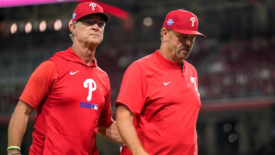 Philadelphia Phillies manager Don Mattingly (8) walks infield coach Bobby Dickerson off of the field
