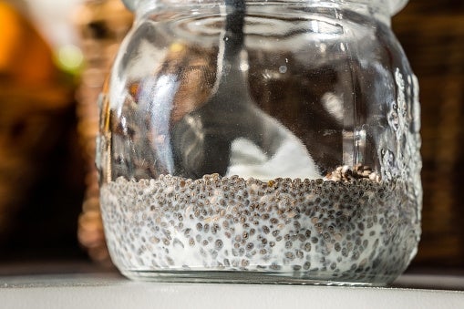 Jar filled with chia seed pudding, topped with visible seeds