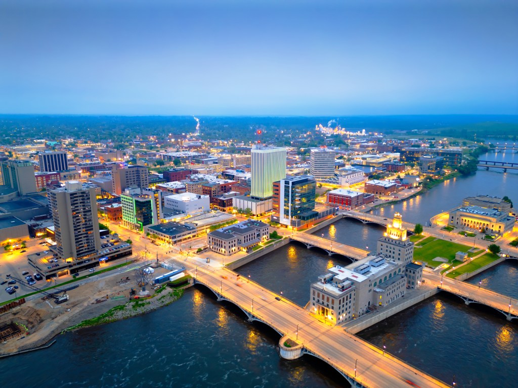 The cityscape of Cedar Rapids, Iowa, at dusk.