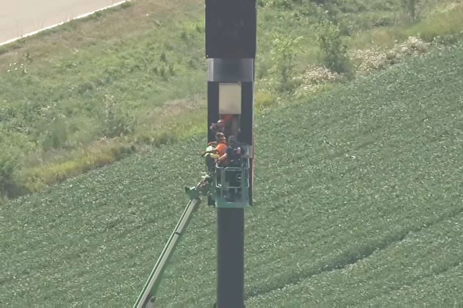 Man spends hours trapped 130 feet in the air after getting stuck in gas station sign