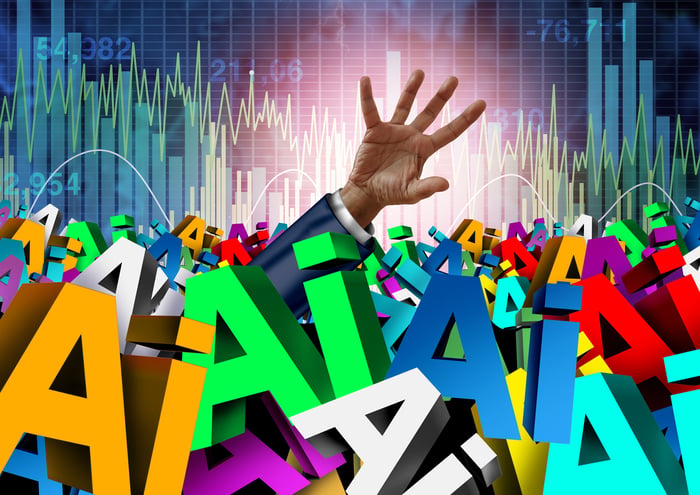 A hand reaching out from a pile of AI letters.