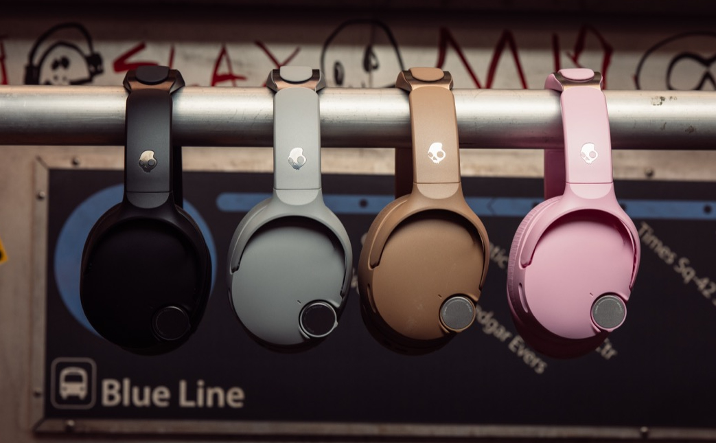 The four color options of the Skullcandy Crusher 1080 ANC headphones hanging from a pole