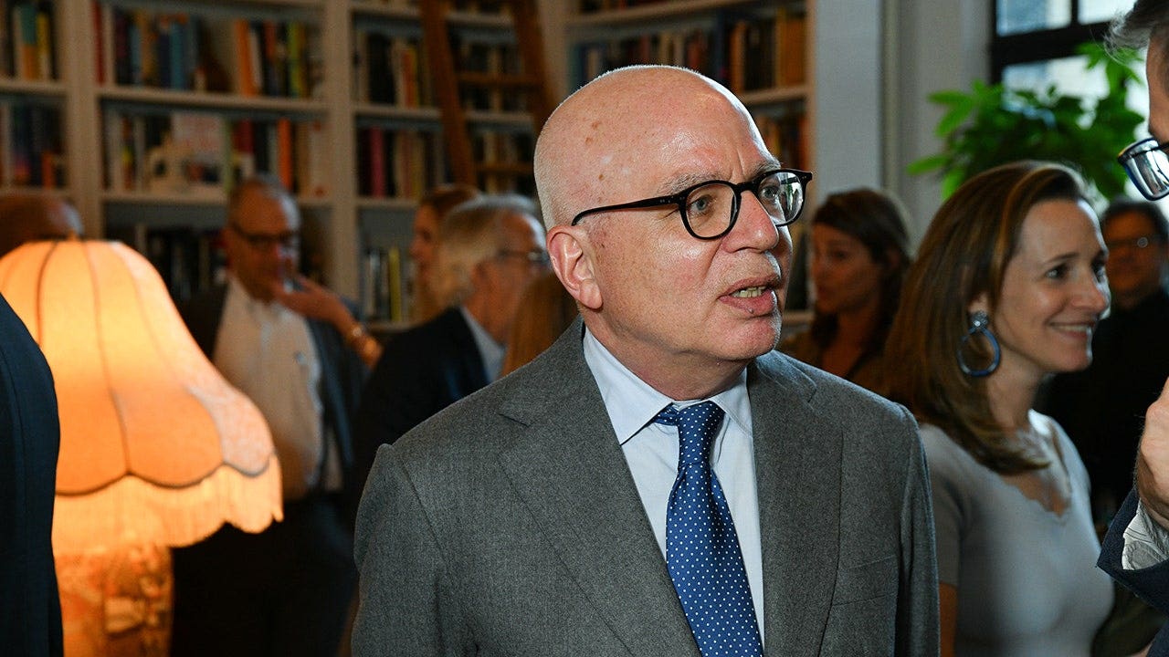 Michael Wolff standing at a book launch event in New York City