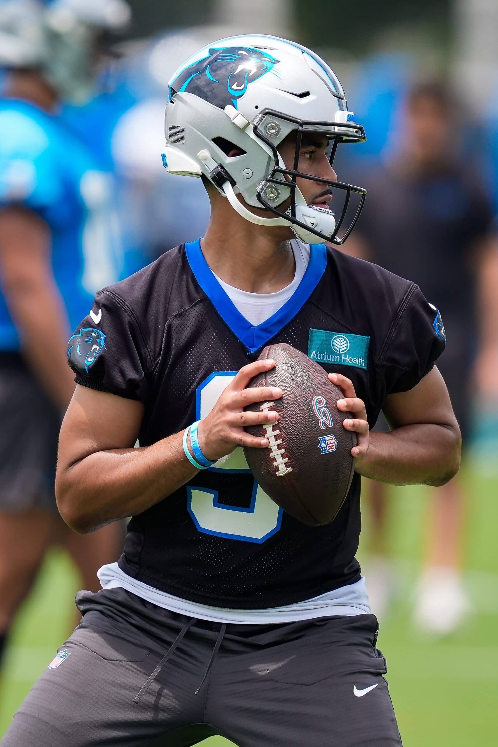 Jun 9, 2026; Charlotte, NC, USA; Carolina Panthers quarterback Bryce Young (9) looks downfield during the first day of mini camp at Bank of America Stadium practice facility. Mandatory Credit: Jim Dedmon-Imagn Images
