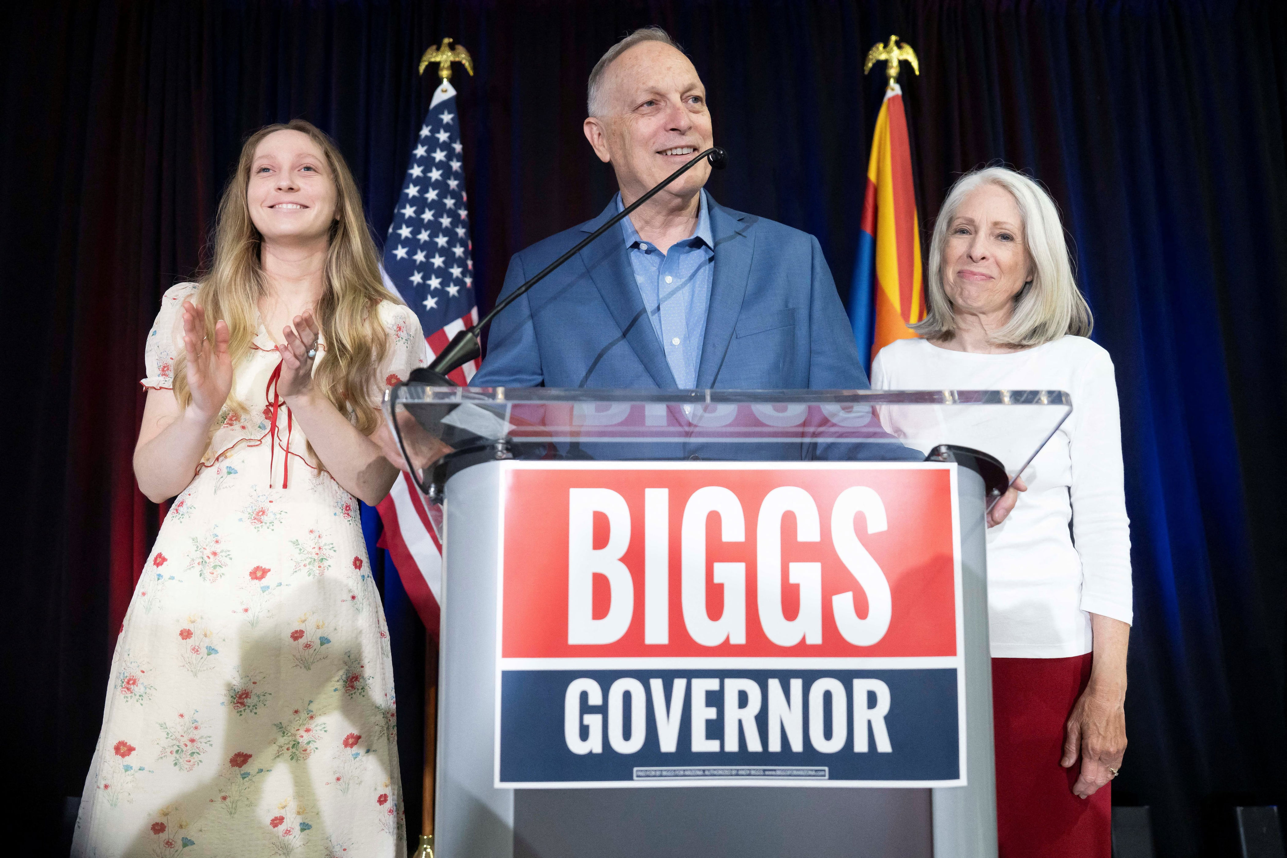 U.S. Representative and Republican nominee for Arizona governor Andy Biggs celebrates his win with his daughter, Mylie, and wife, Cindy, during his primary Election Night watch party. / Rebecca Noble / REUTERS