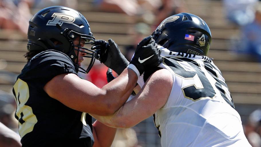 Purdue Boilermakers offensive lineman Bakyne Coly (78) blocks defensive lineman Drake Carlson (98).