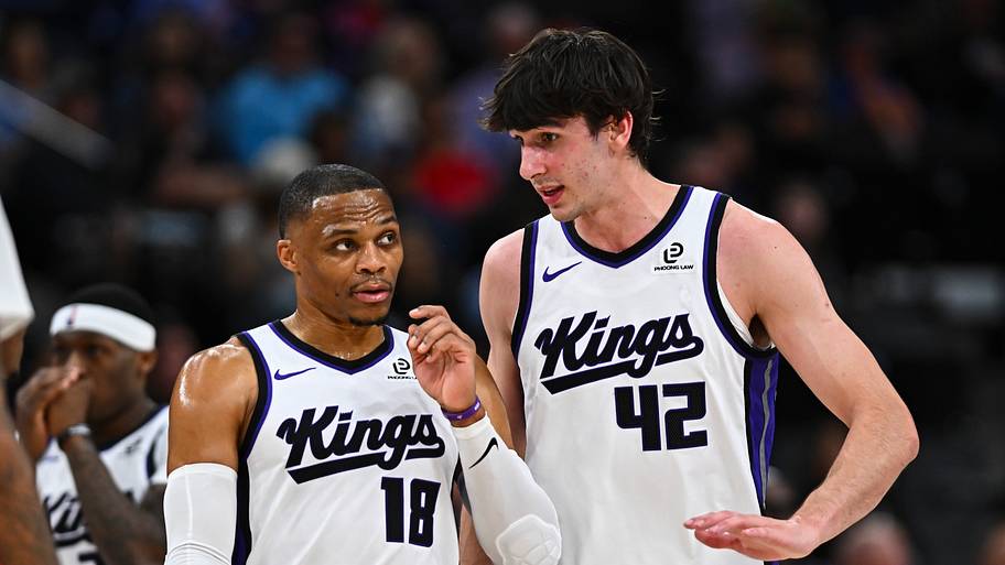 Sacramento Kings center Maxime Raynaud (42) talks to guard Russell Westbrook