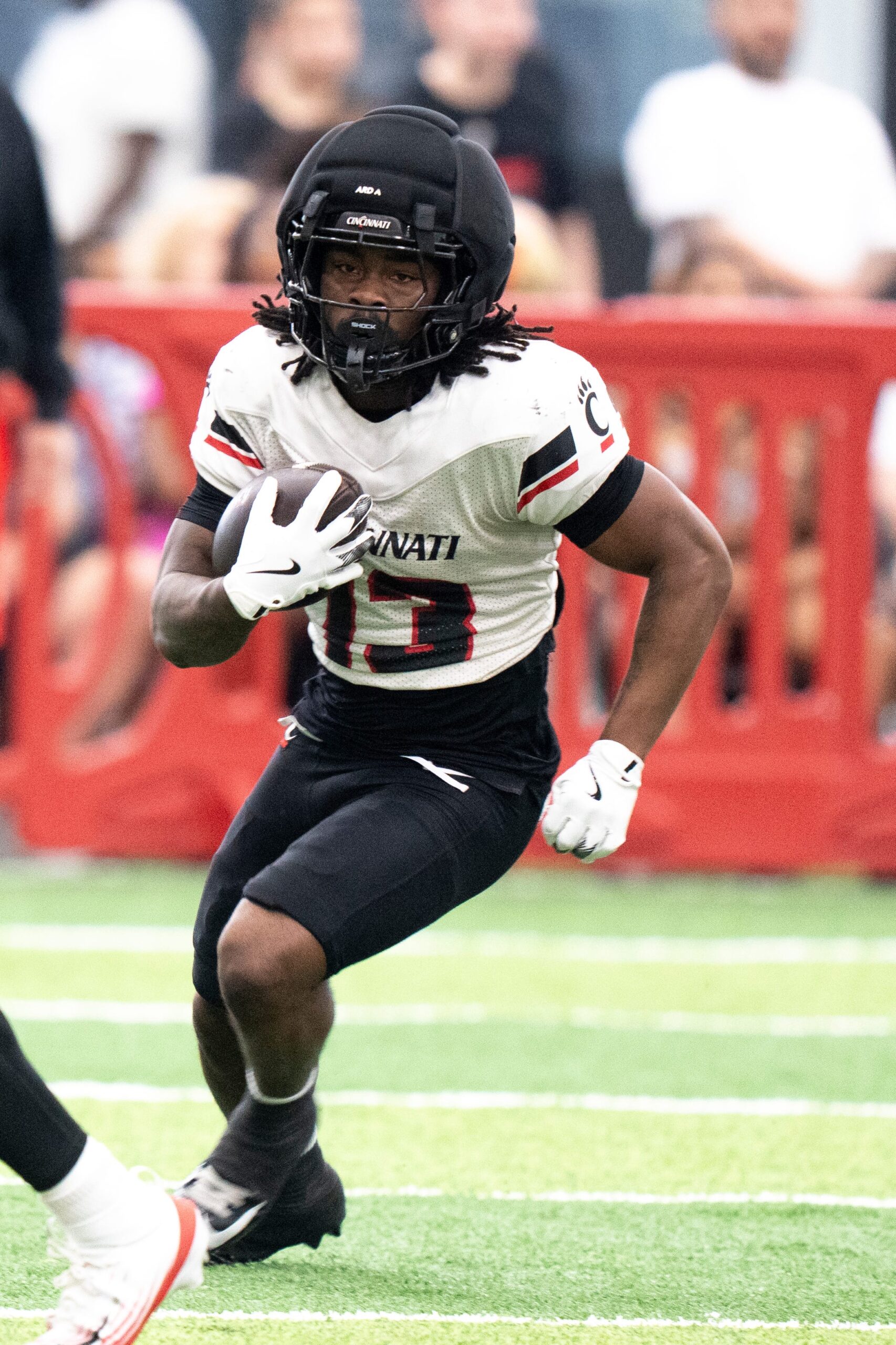 Cincinnati Bearcats running back Zion Johnson (13) runs with the ball during the Cincinnati Bearcats Spring Showcase in Cincinnati on Saturday, April 18, 2026.