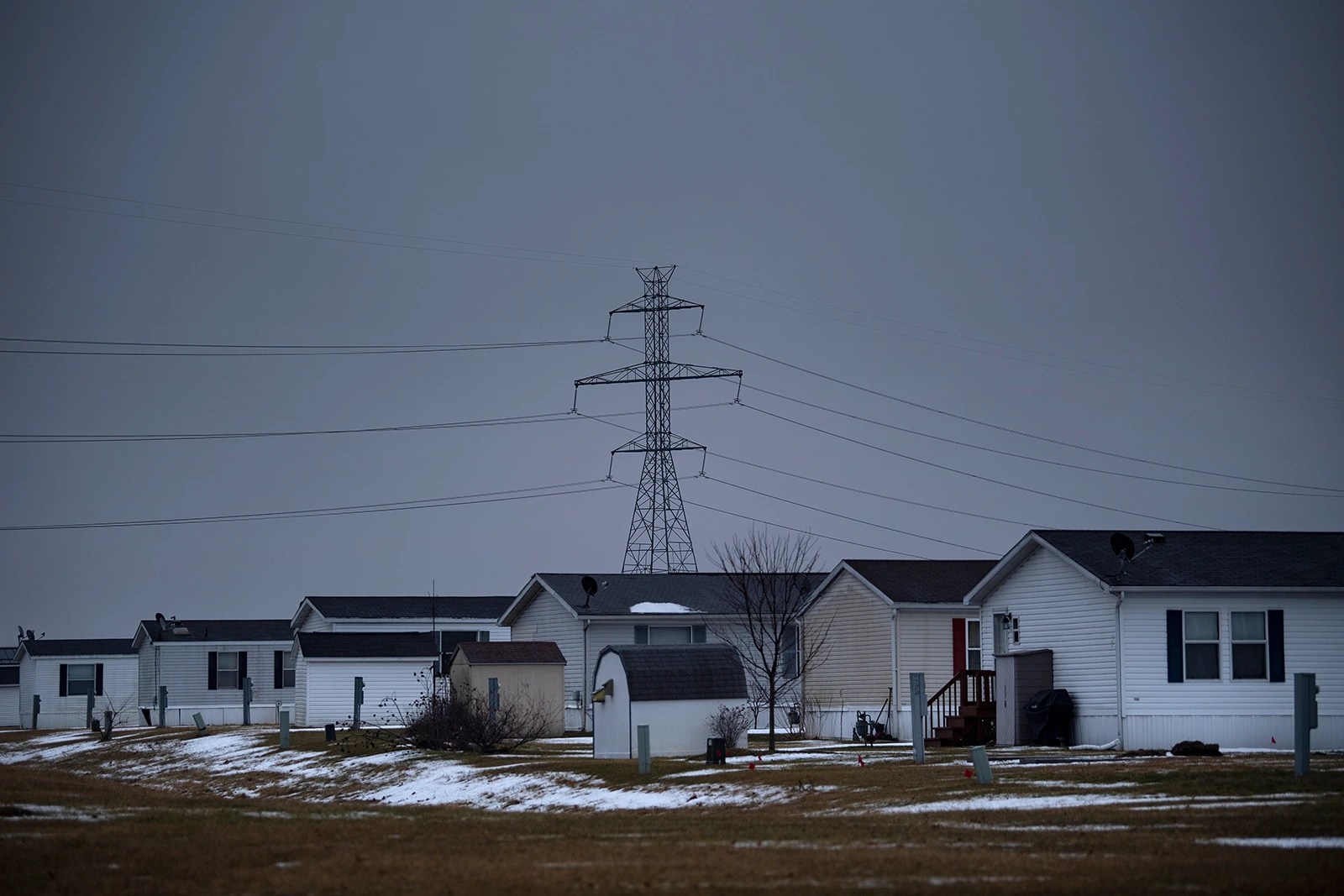 Power lines behind trailer homes on Jan. 24, 2020, in Bristol, Ind.