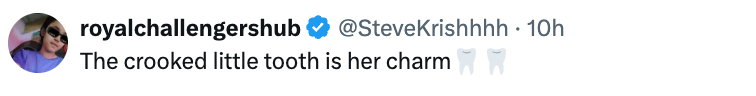 Screenshot of a tweet by royalchallengershub mentioning @SteveKrishhhh: "The crooked little tooth is her charm" with tooth emojis