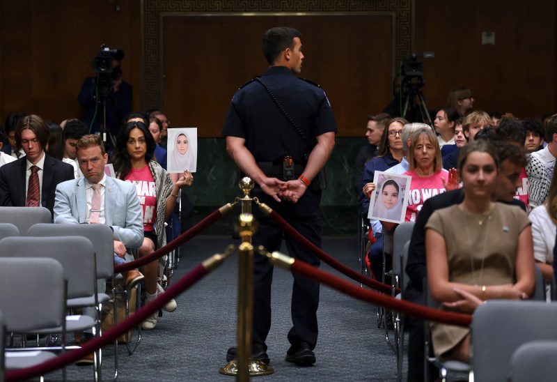 WASHINGTON, DC - JULY 21: Anti-war protesters hold up photographs ahead of a Senate Appropriations Committee hearing in the Dirksen Senate Office Building on Capitol Hill on July 21, 2026 in Washington, DC. Members of the Trump administration appeared before the committee to request supplemental funding amid recent escalation in the war with Iran. (Photo by Anna Moneymaker/Getty Images)
