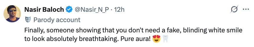 Tweet from a parody account saying, "Finally, someone showing you don’t need a fake smile to look breathtaking. Pure aura!" with heart and star emojis