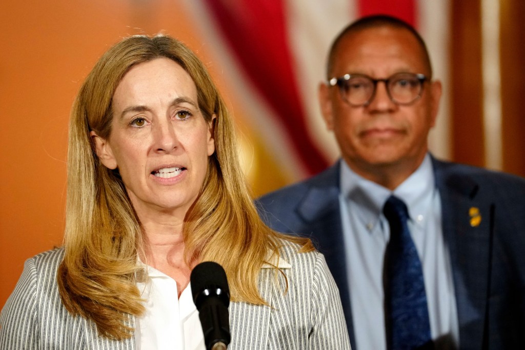 Governor Mikie Sherrill is shown in front of Lieutenant Governor Dale G. Caldwell, as she announces the budget has been passed,
