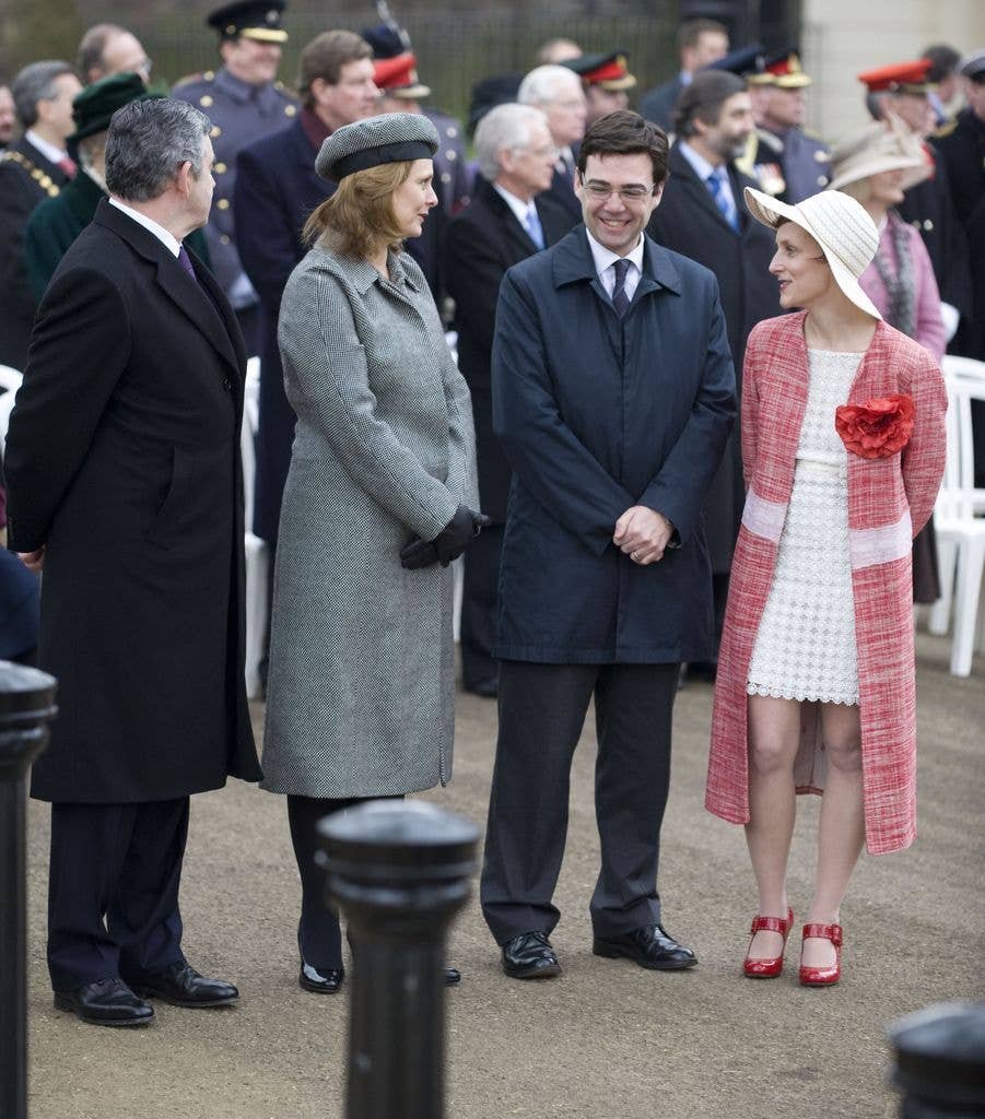 Marie paired the minidress with a red tweed coat
