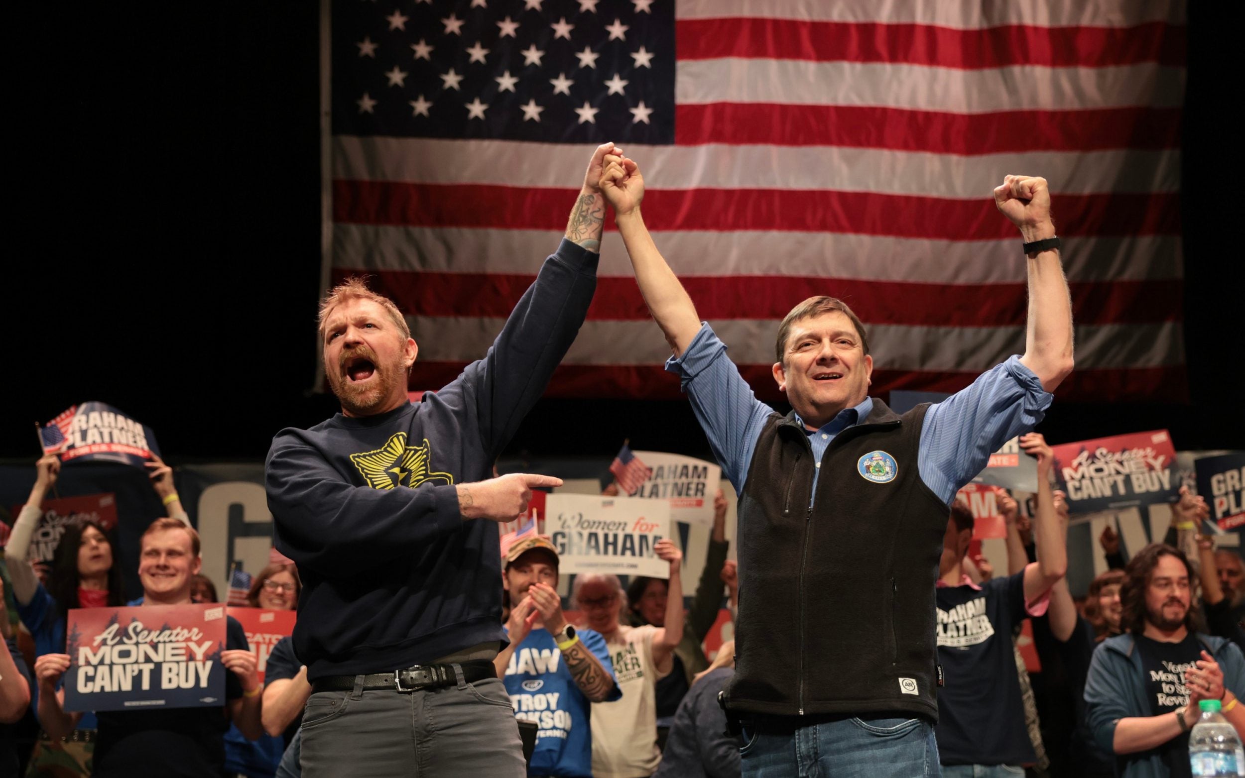 Mr Platner, left, and Mr Jackson stand together during aFighting Oligarchy tour stop at the University of Maine