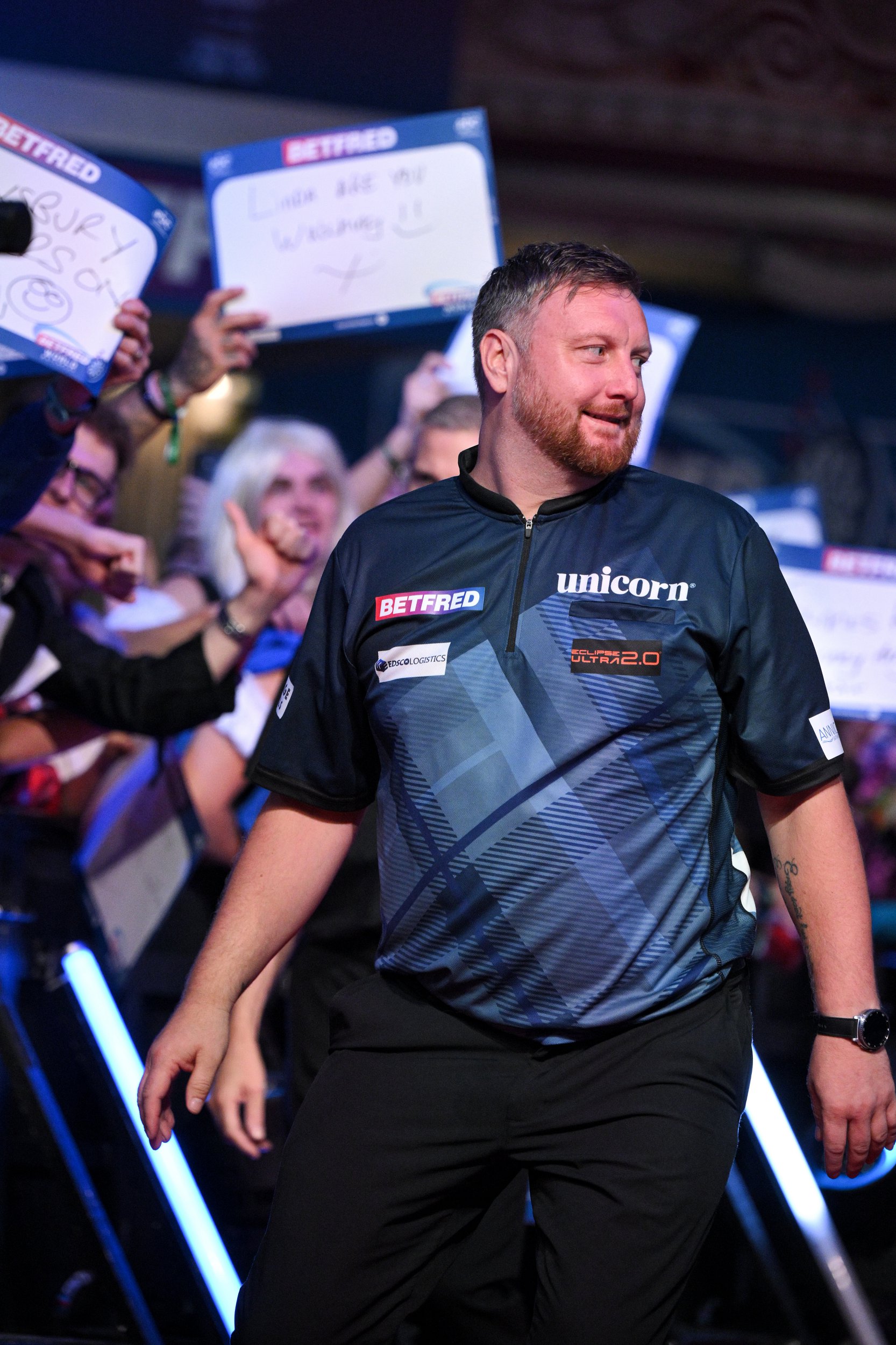 BLACKPOOL, ENGLAND - JULY 22: Cameron Menzies walks out prior to his match against Ross Smith (not shown) day five of the 2026 Betfred World Matchplay at Winter Gardens on July 22, 2026 in Blackpool, England. (Photo by Ben Roberts Photo/Getty Images)