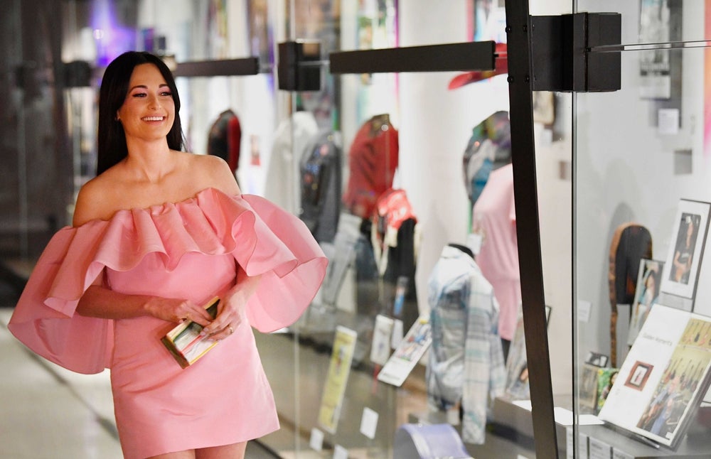 Kacey Musgraves is born in Golden, Texas in 1988. Musgraves smiles as she looks over her new exhibit at the Country Music Hall of Fame Monday, July 1, 2019. Nas Kacey Musgraves 01