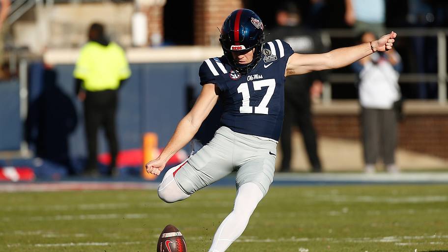 Mississippi Rebels kicker Lucas Carneiro kicks off.
