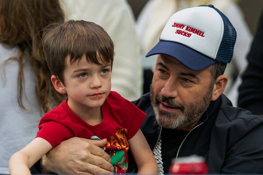 Jimmy Kimmel holds his son Billy Kimmel during the LA Bowl game between Washington State Cougars and Fresno State Bulldogs at SoFi Stadium on December 17, 2022 in Los Angeles, California.