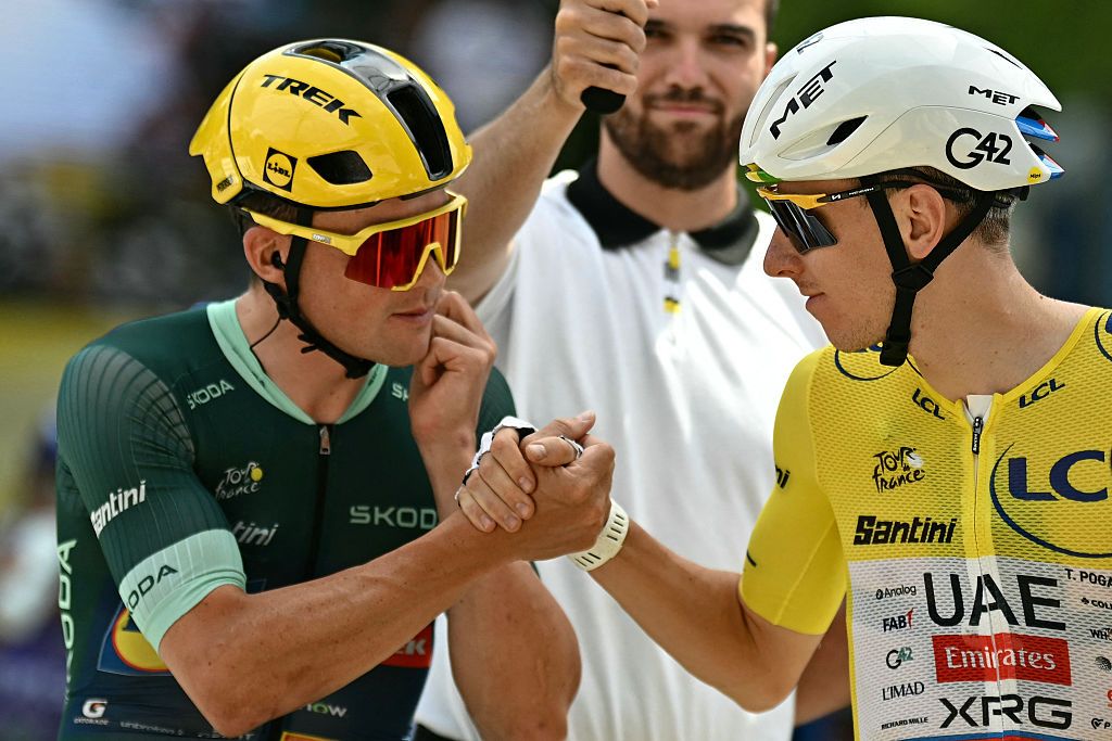Mads Pedersen in green jersey shakes hands with yellow jersey wearing Tadej Pogacar