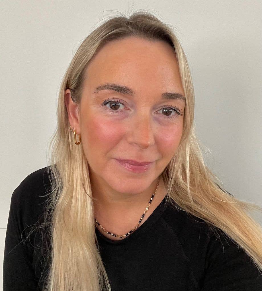 selfie of a blonde woman with blurred makeup