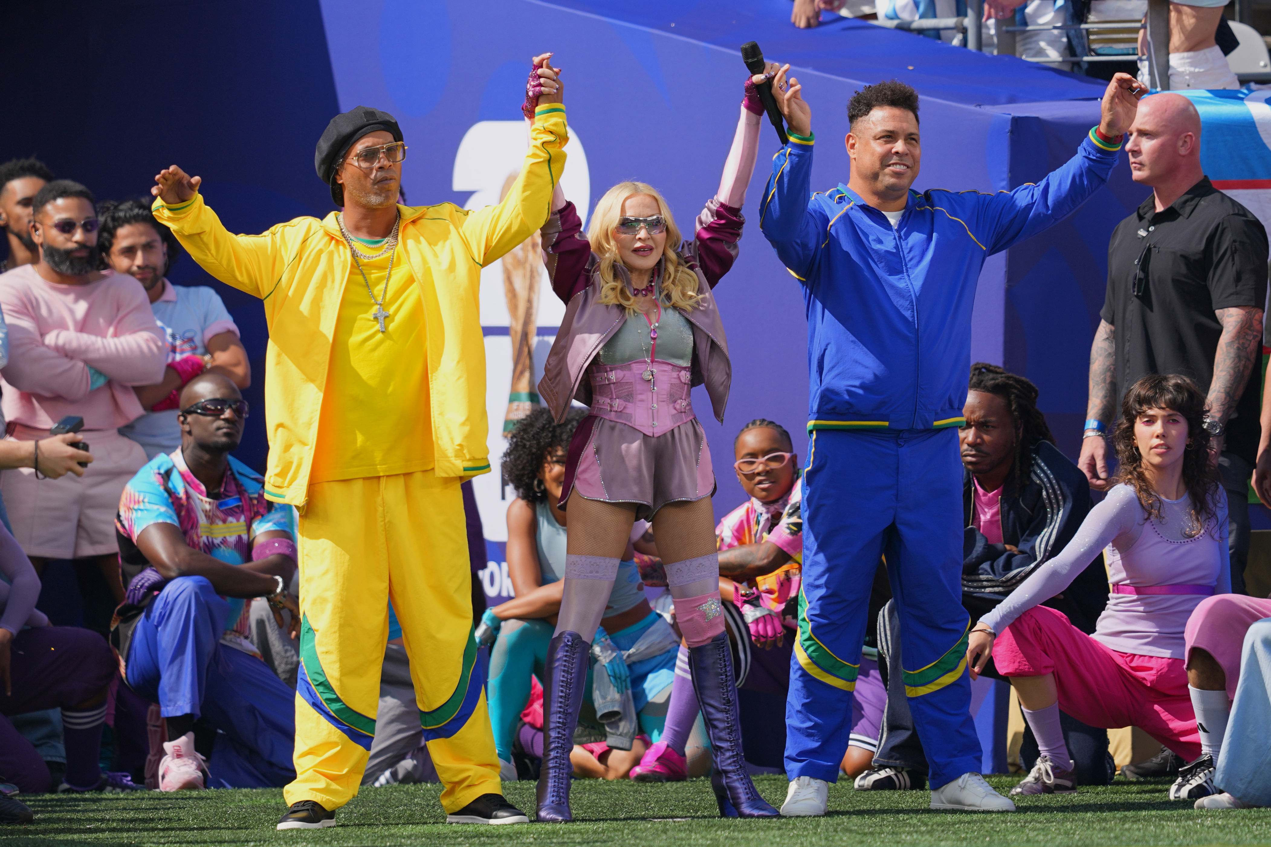 Ronaldinho and Ronaldo perform with Madonna during the halftime show in the World Cup final soccer match between Spain and Argentina in East Rutherford, N.J., near New York, Sunday, July 19, 2026. (AP Photo/Julio Cortez)