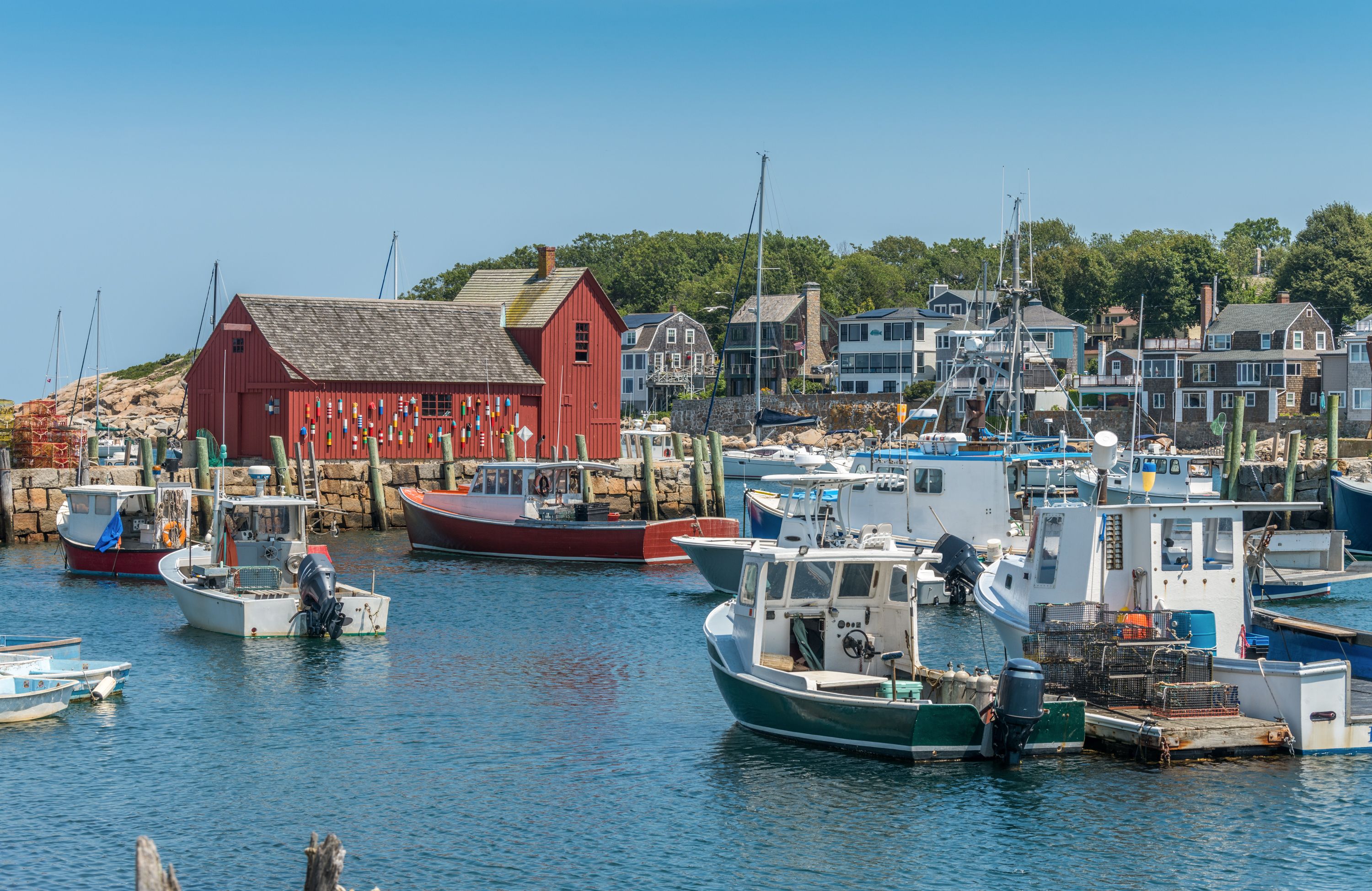 View of the iconic “Motif No. 1,” a well-known and iconic fisherman's cottage in the harbor of Rockport, Massachusetts. The reddish cottage was named by painter Lester Hornby as it was a recurring theme among his art students.