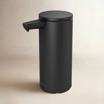 Sleek, cylindrical automatic soap dispenser with a minimalist design, ideal for modern home or bathroom decor