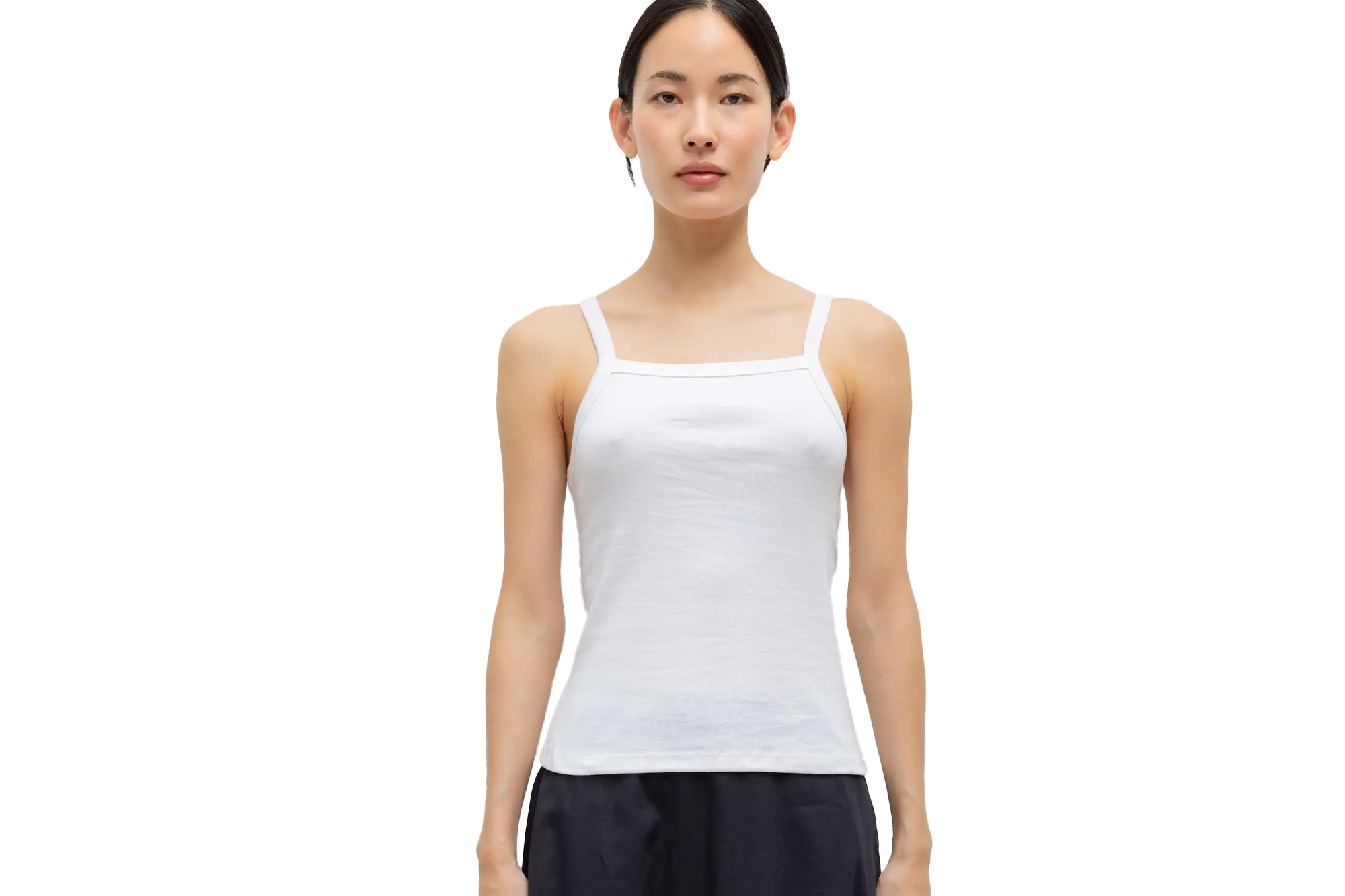 A model wearing a white tank top.