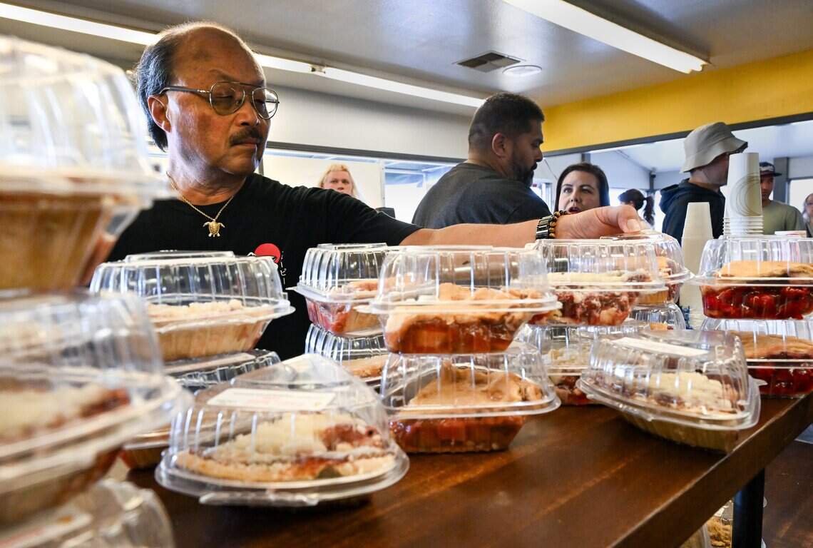 Customers browse pie slices on a counter at Ikeda’s in Auburn on Sunday, July 19, 2026. Ikeda’s was recently named the #1 best pie shop in America according to USA Today’s 10Best list.