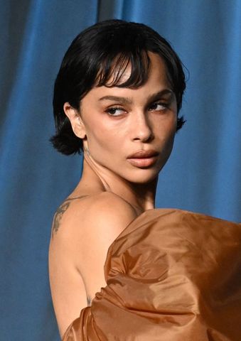 Zo Kravitz gazing sideways with a neutral expression