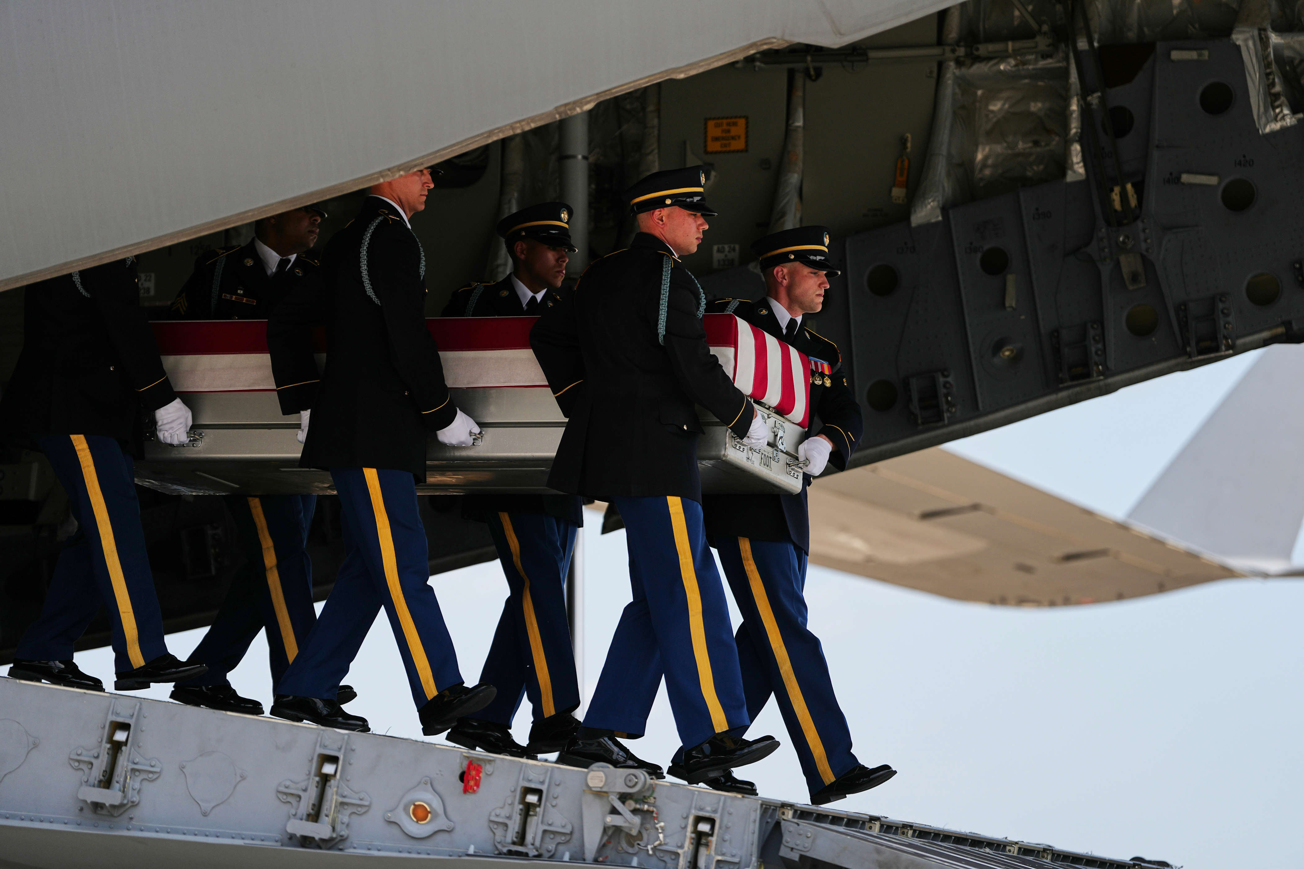 A U.S. Army carry team moves a transfer case containing the remains of 1st Lt. Tyler James Feehan of Ewa Beach, Hawaii, Wednesday, July 22, 2026, at Dover Air Force Base, Del. (AP Photo/Matt Rourke)