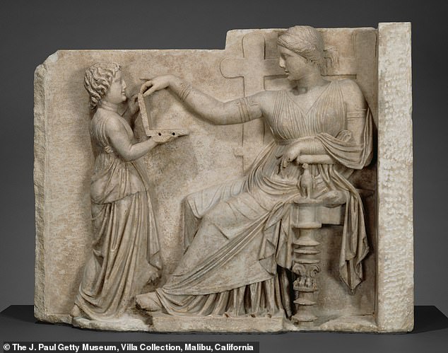 Ancient Greek statue holding a 'laptop' fuels surge in claims that time travel is real