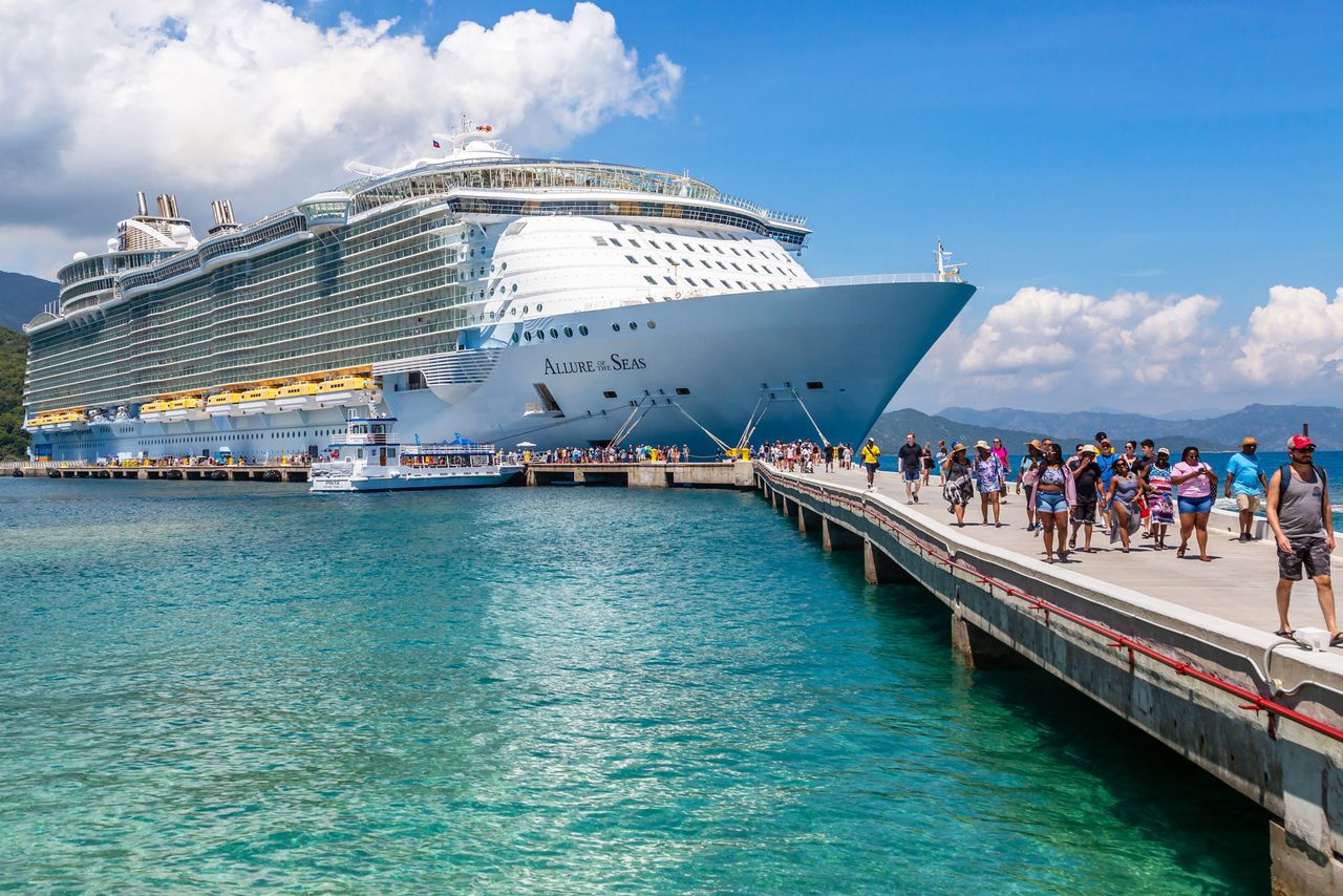 Cruise passengers disembark from the Royal Caribbean Allure of the Seas cruise ship on Royal Caribbean's private coastal peninsula of Labadee, Haiti