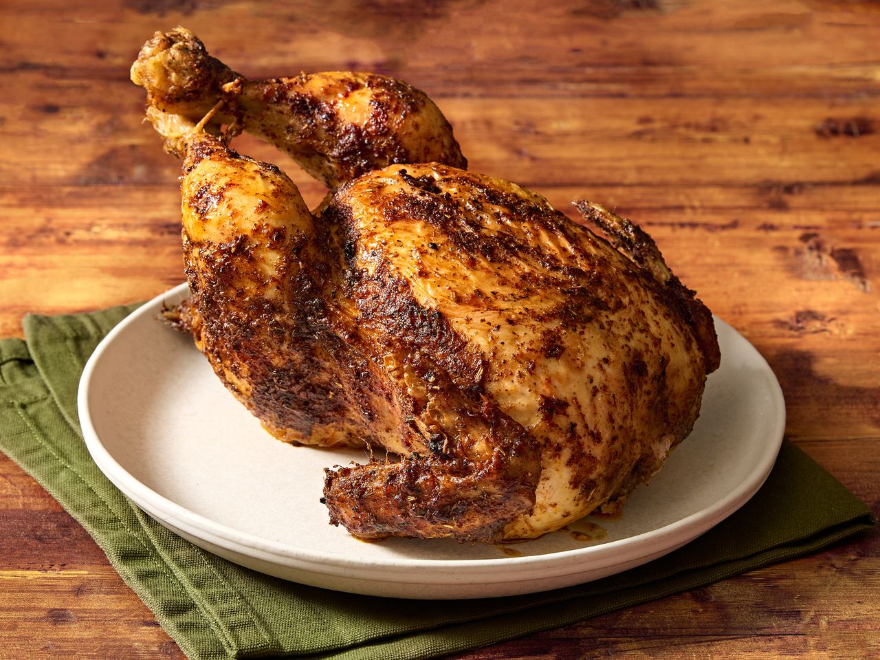 Roasted whole chicken on a plate.