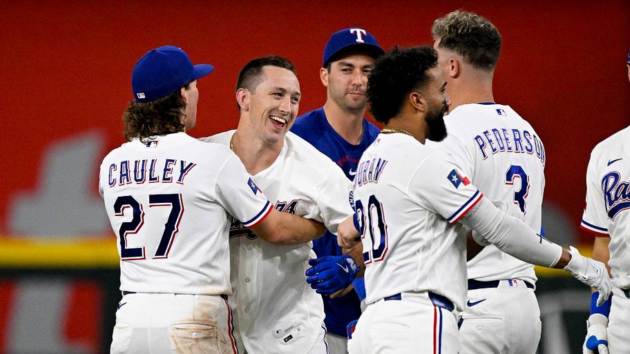 Texas Rangers outfielder Wyatt Langford celebrates with teammates during a game