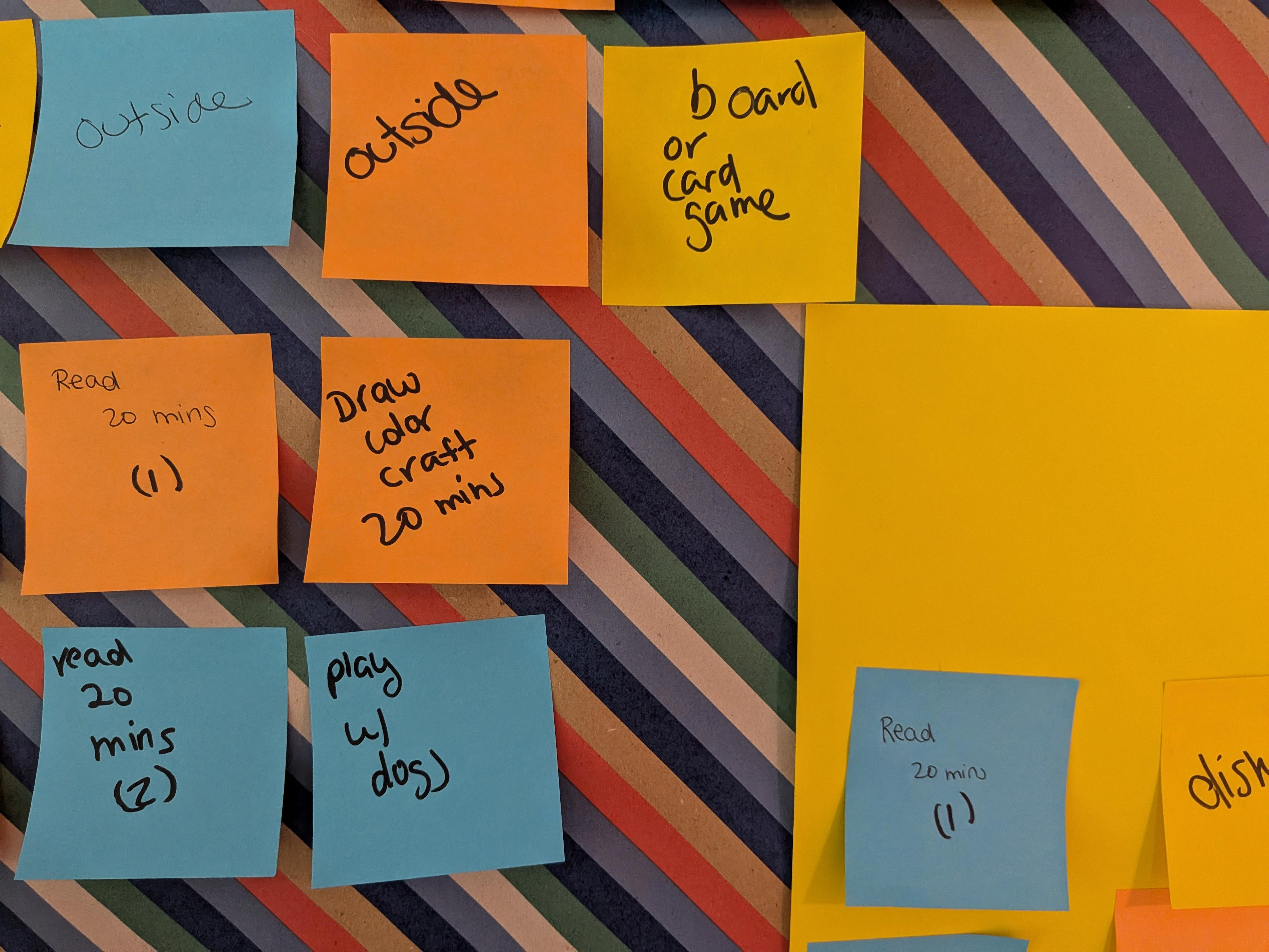 Summer activities for kids written out on sticky notes.