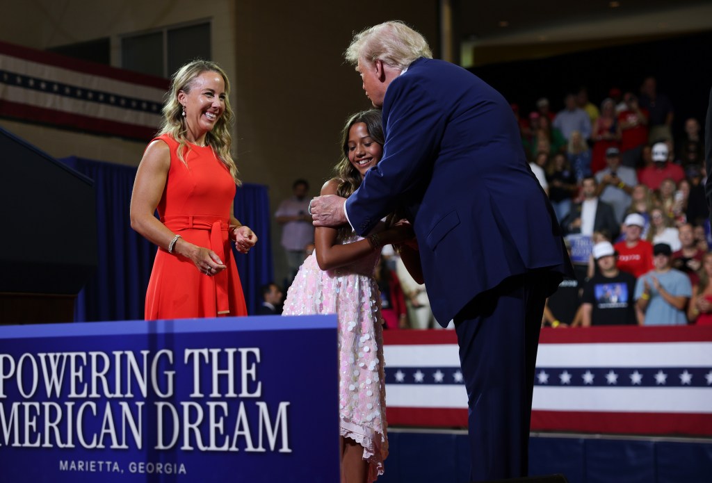 Trump holds hands with toddler and mocks ‘Pee-wee’ Jon Ossoff at Georgia Trump Accounts rally
