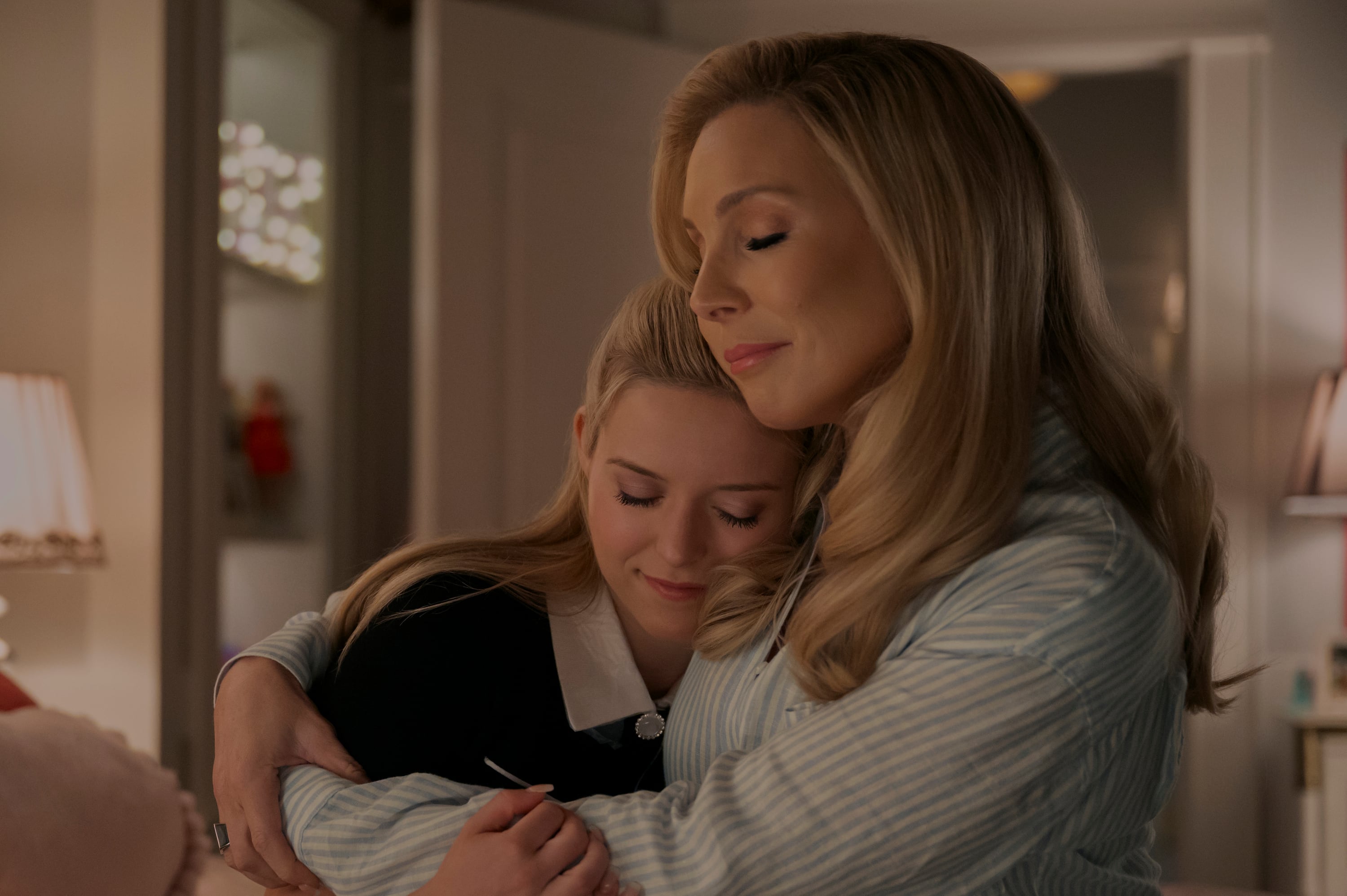 Left to right: Elle (Lexi Minetree) and Eva (June Diane Raphael) embrace in