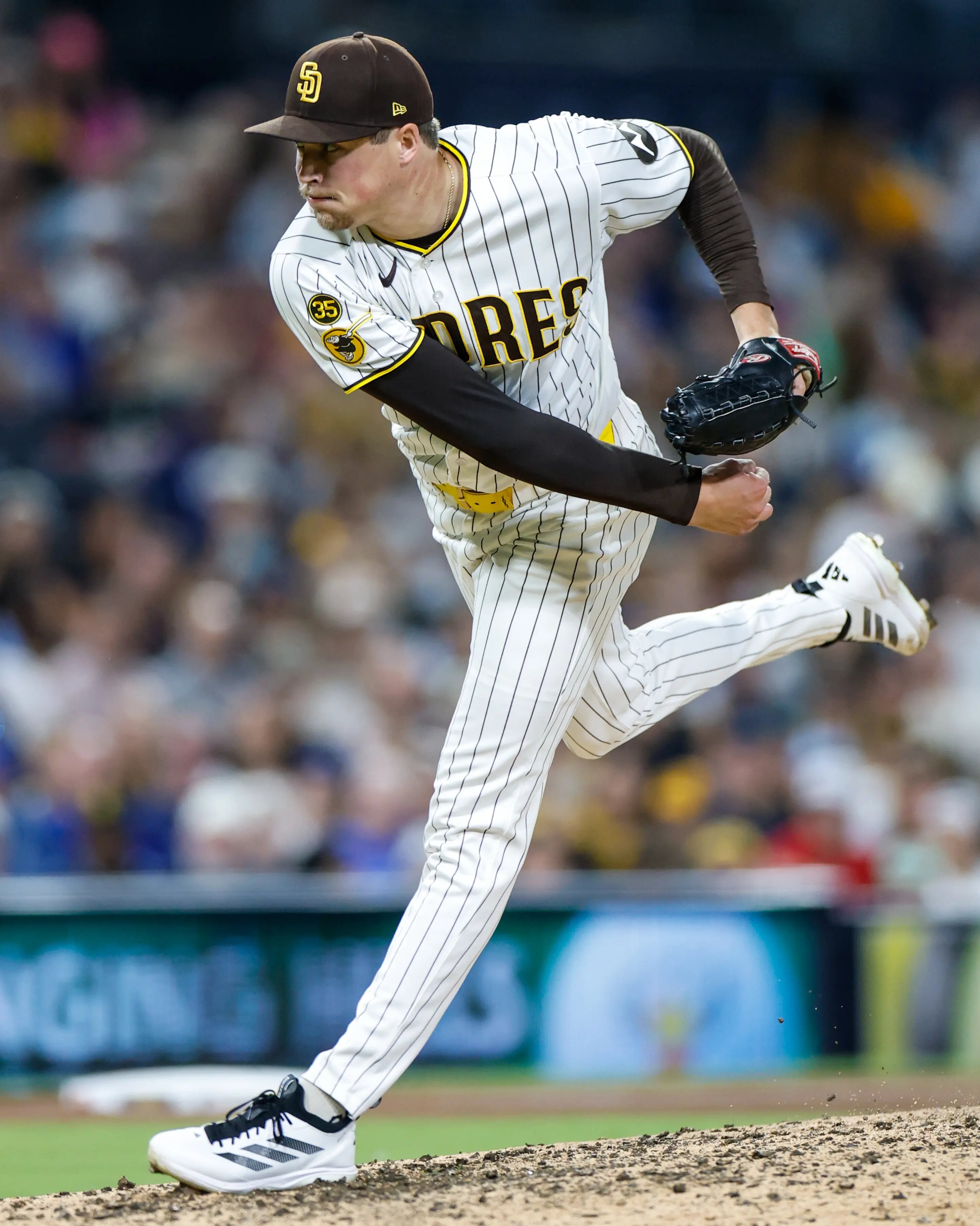 Jul 11, 2026; San Diego, California, USA; San Diego Padres relief pitcher Mason Miller (22) throws a pitch during the ninth inning against the Toronto Blue Jays at Petco Park. Mandatory Credit: David Frerker-Imagn Images