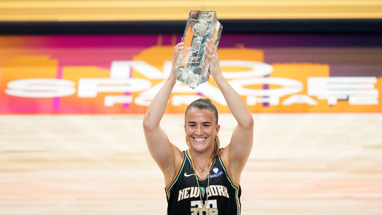 Sabrina Ionescu celebrates after winning a competition