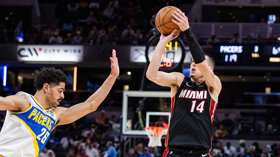 Miami Heat guard Tyler Herro (14) shoots the ball while Indiana Pacers guard Ben Sheppard (26)