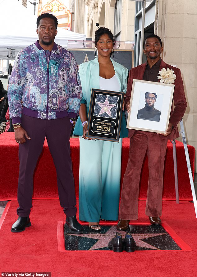 Chadwick Boseman's brothers Derrick and Kevin are requesting that his widow Taylor Simone Ledward Boseman (pictured center with them in 2025) be relieved of her duties as the administrator of the late actor's $3.8 million estate