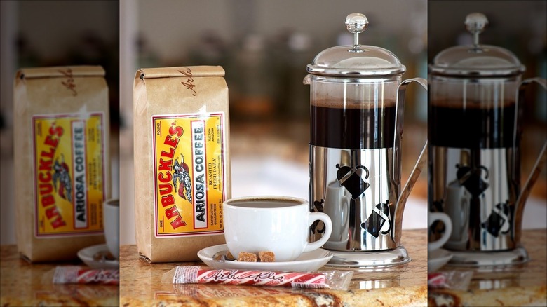 An image of Arbuckle coffee paired with a peppermint stick and two lumps of sugar.