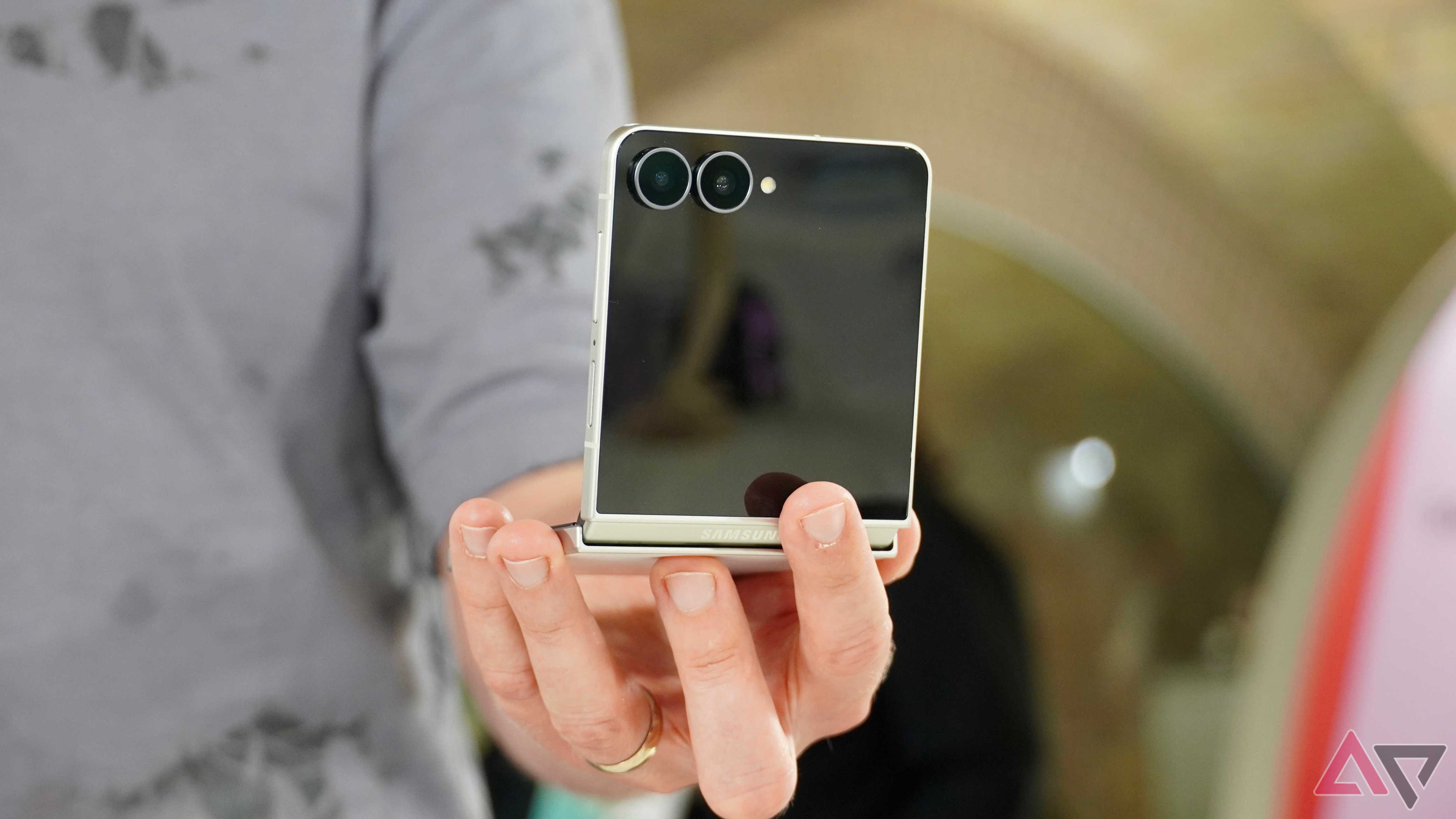 A person holding the Samsung Galaxy Z Flip 8