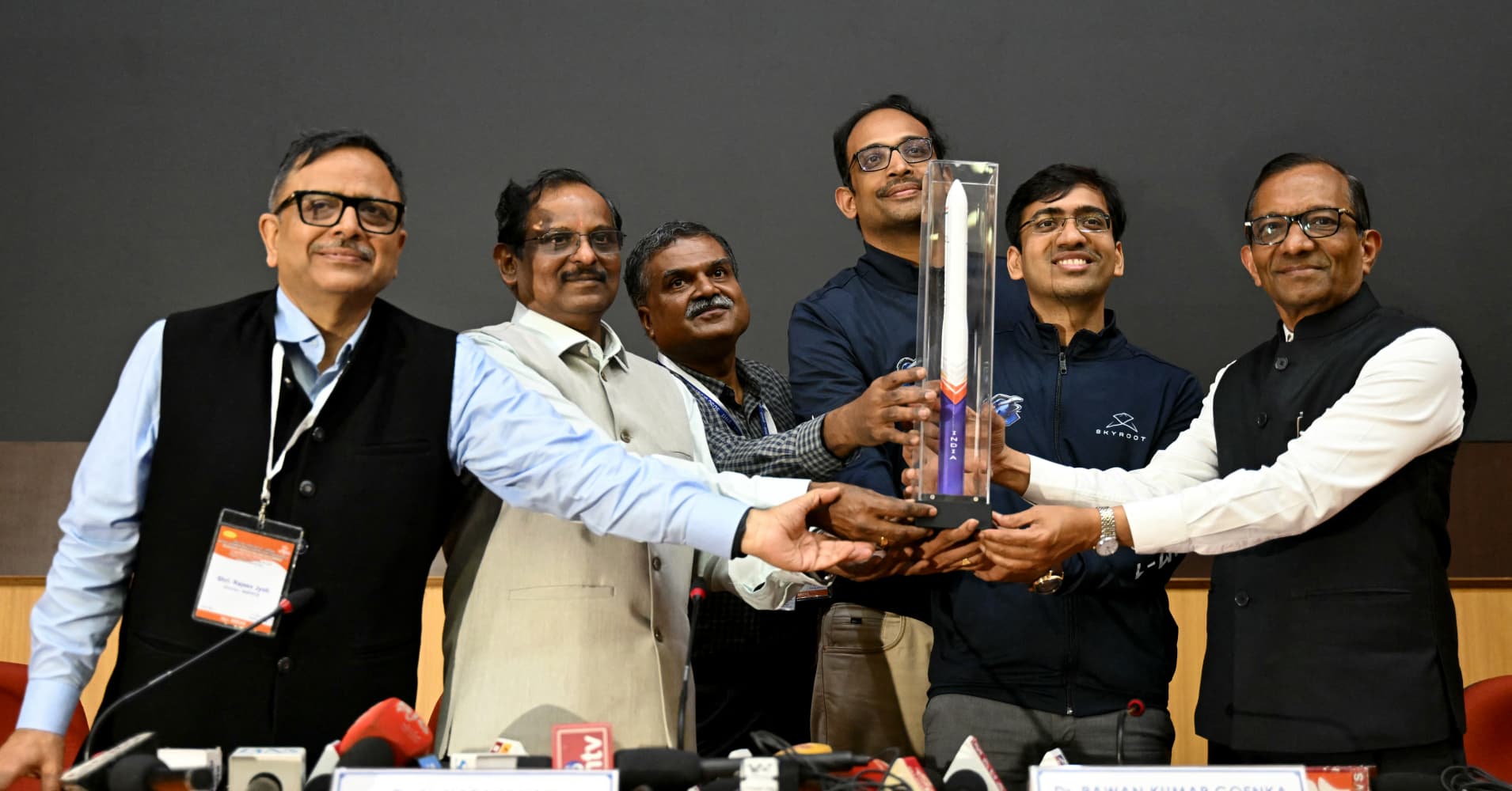 Indian Space Research Organisation (ISRO) Chairman V Narayanan (2L), Skyroot Aerospace CEO Pawan Kumar Chandana (2R) alongwith COO and co-founder Naga Bharath Daka (3R) pose with a replica of the Vikram-1 rocket, during a press conference after its successful launch from the Satish Dhawan Space Centre in Sriharikota, an island off the coast of Andhra Pradesh on July 18, 2026. India's first privately built orbital rocket took its maiden flight on July 18, its company said, marking a significant step for the South Asian giant as it eyes a bigger slice of the global space economy. (Photo by R. Satish BABU / AFP via Getty Images)